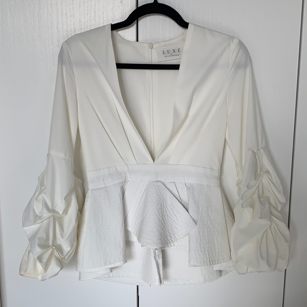 Luxe low cut white peplum blouse